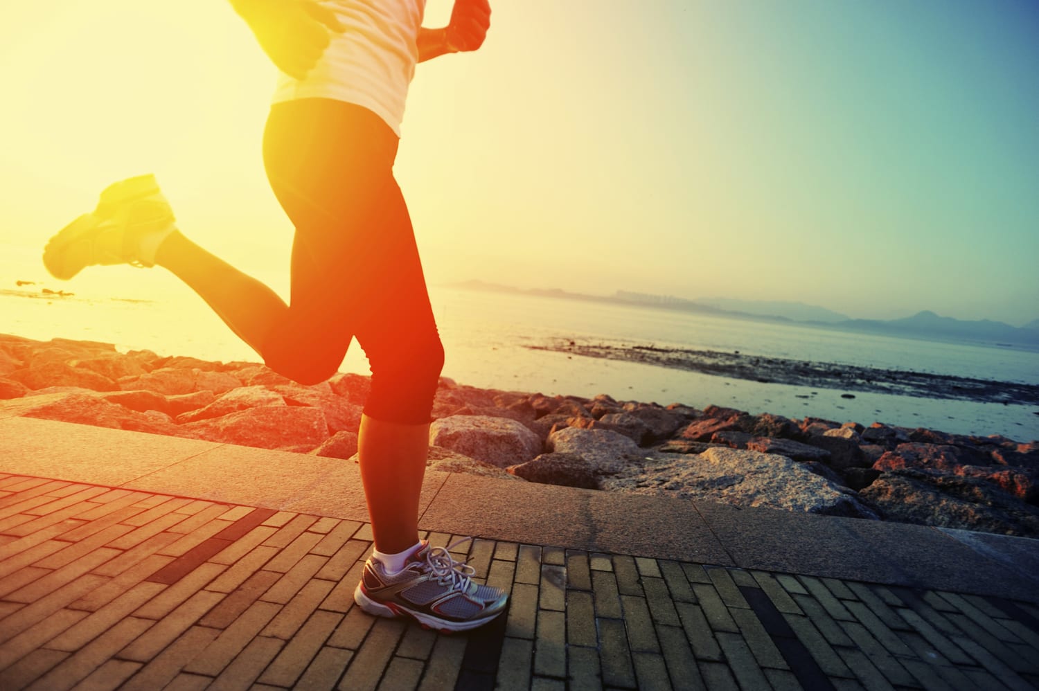 healthy lifestyle woman running at sunrise seaside 1500 x 998