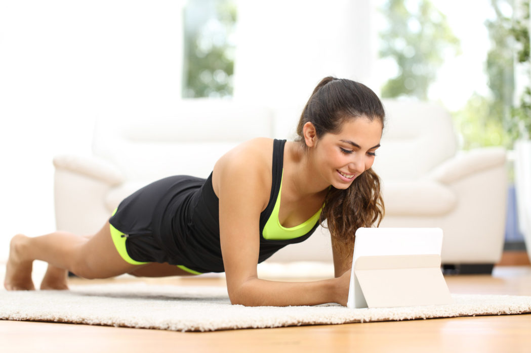 fitness workouts you can do at home - young woman in plank