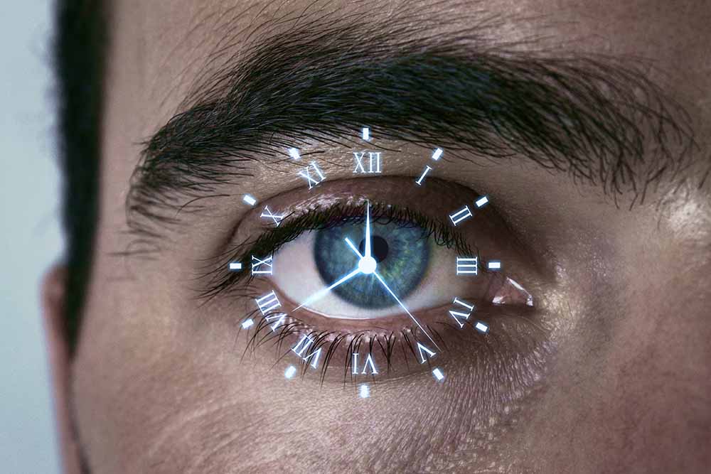 Clock on man's blue eye circadian rhythm (1000 x 667)