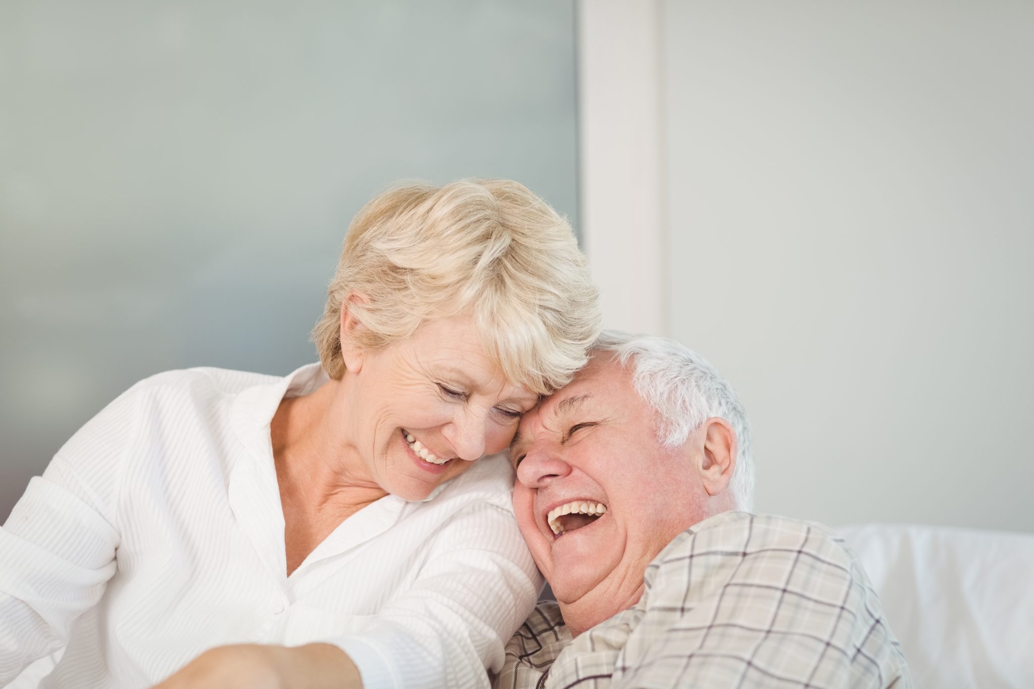 Happy senior couple laughing 2048 x 1365