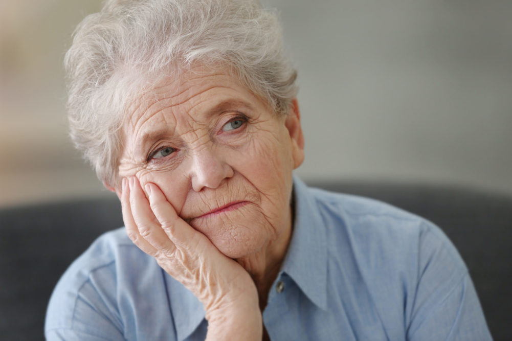 Depressed elderly woman at home 2048 x 1365