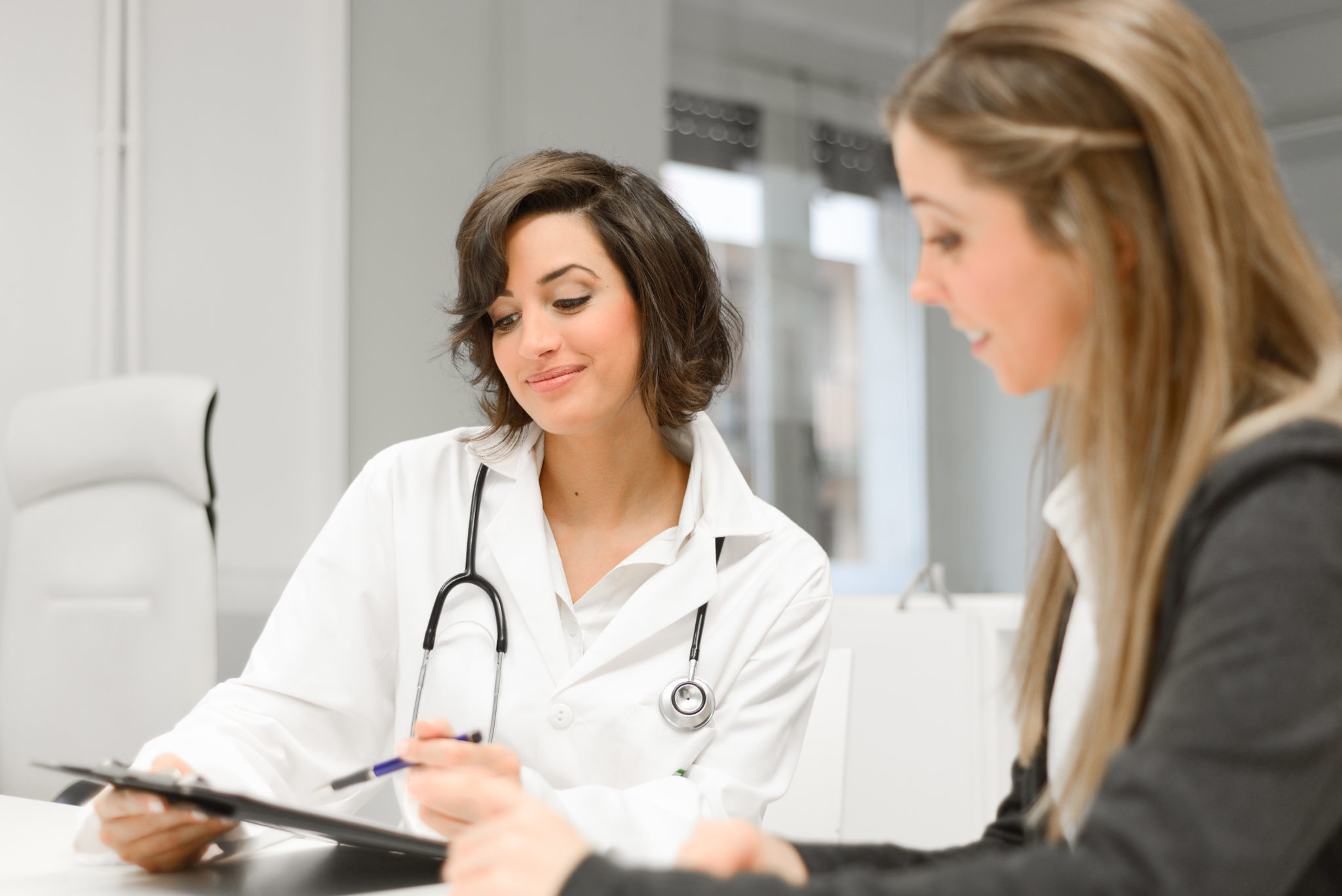 Female doctor explaining diagnosis to her female patient 2048 x 1367