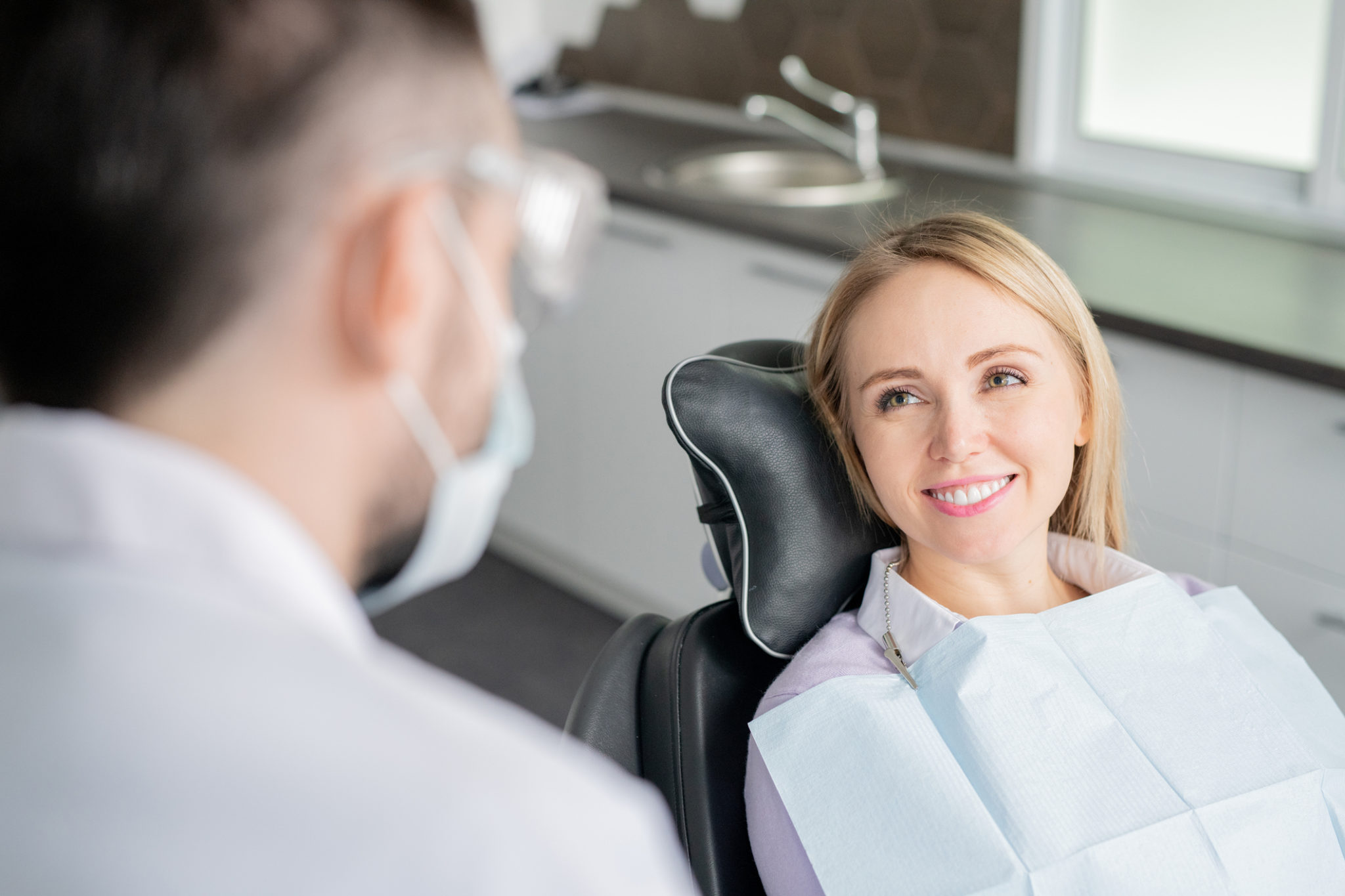dentist with smiling patient