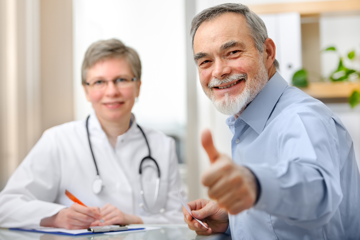 optimism health happy patient with thumbs up
