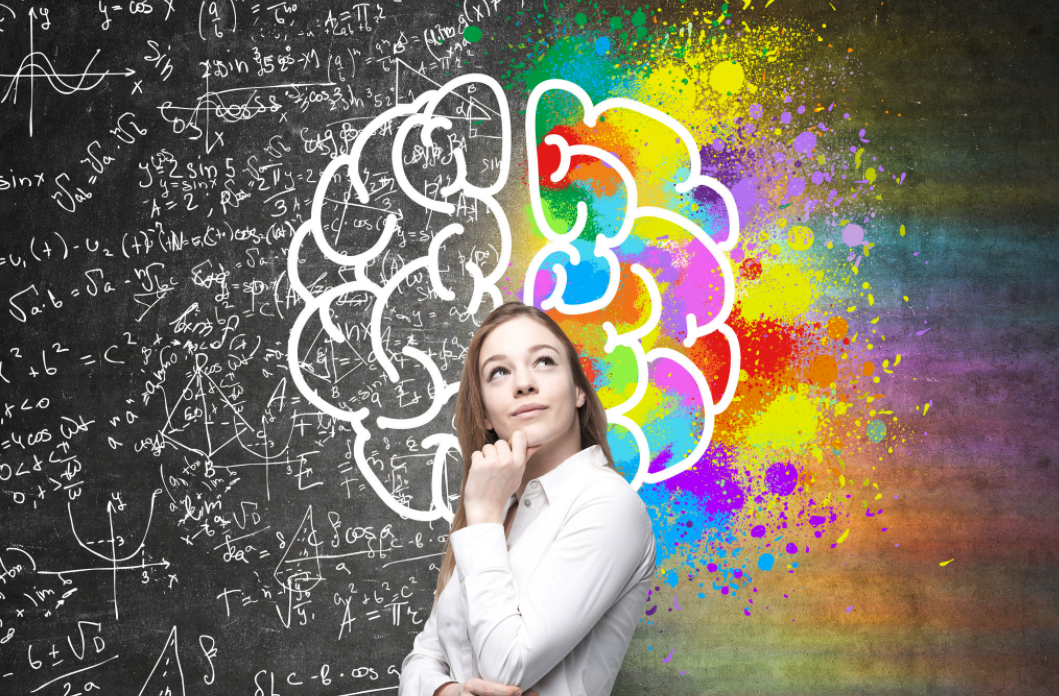 Thoughtful woman in front of brain graphic 1069 x 696