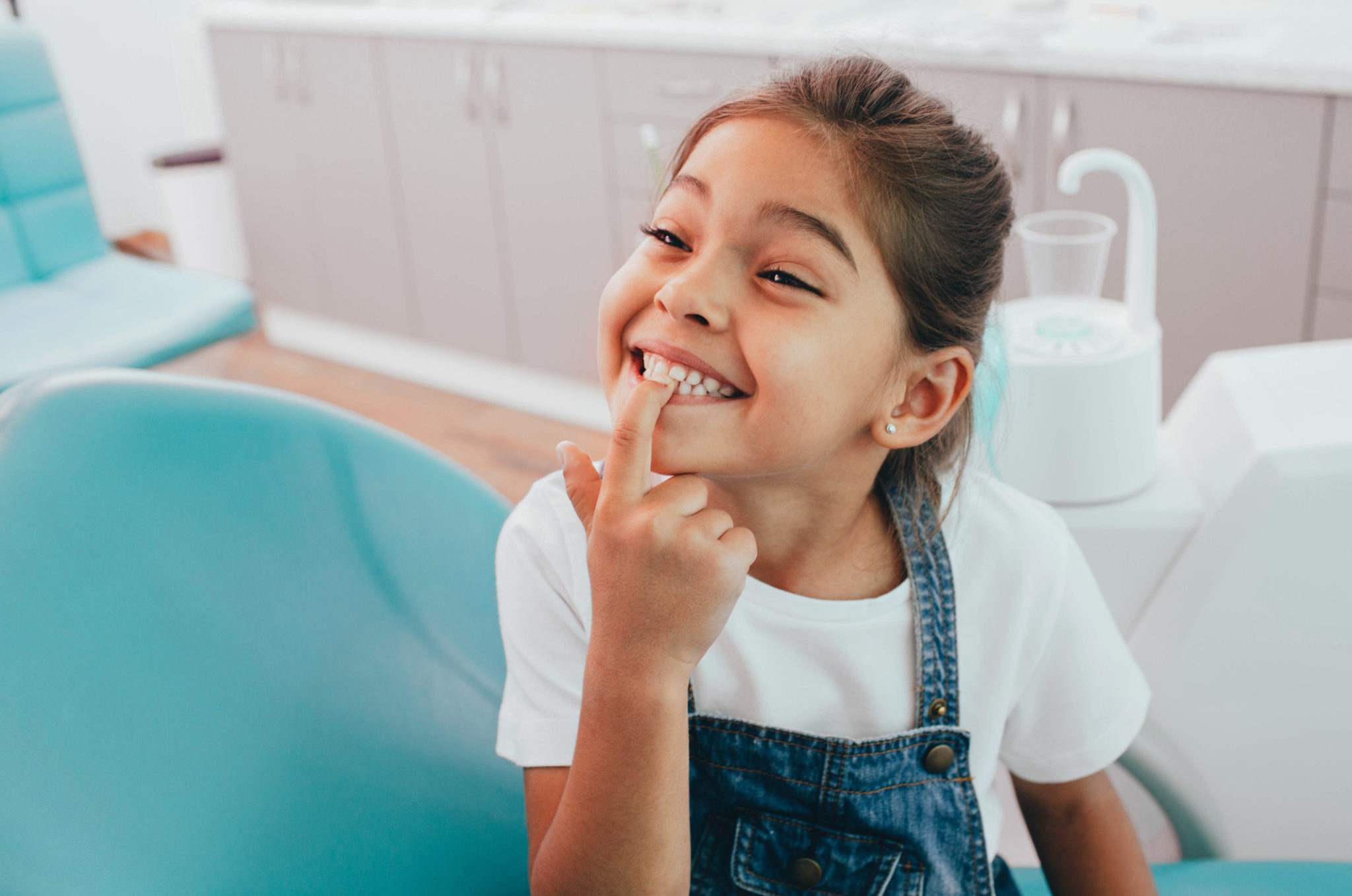 Flouride little girl oral health dental chair