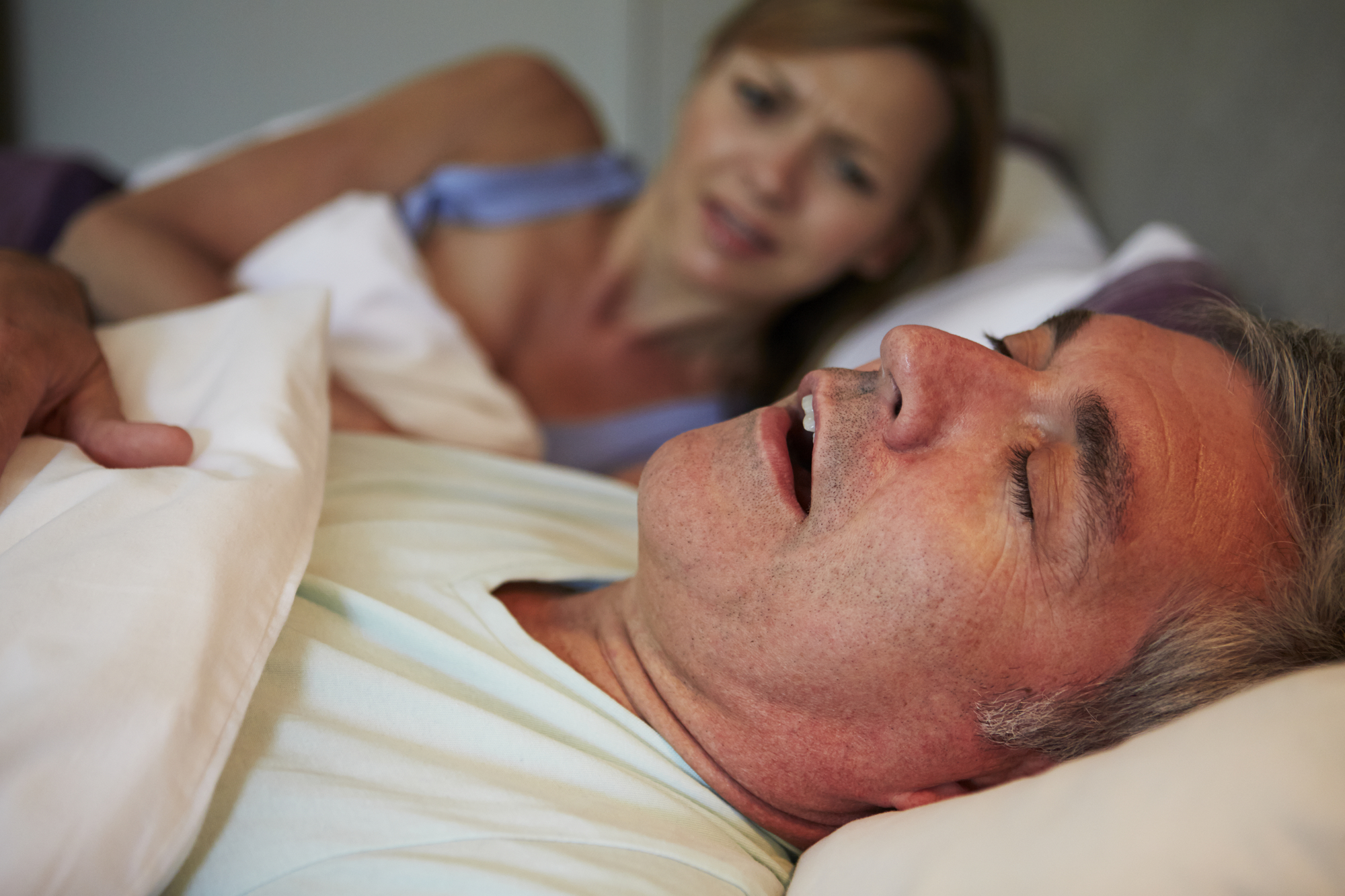 Man Keeping Woman Awake In Bed With Snoring 2000x1333
