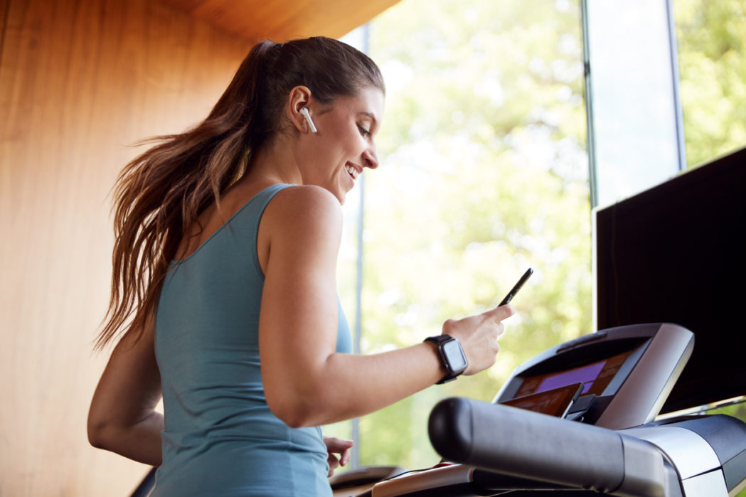 fitness workouts that you can do at home woman running on treadmill