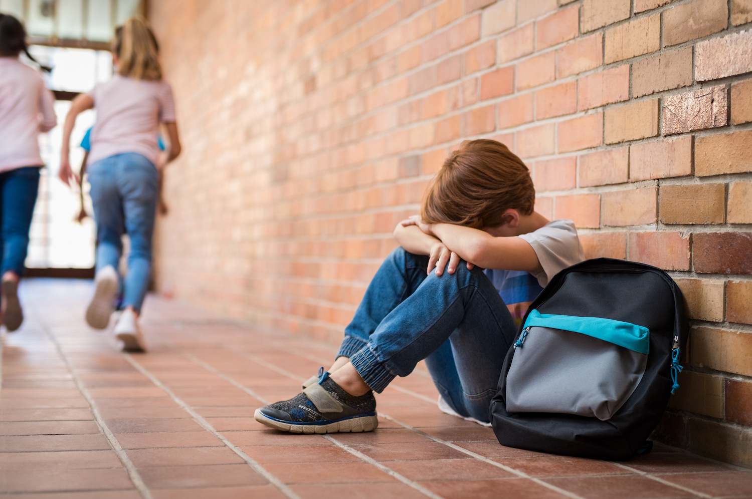 mental-health-education-schools sad boy in school hallway