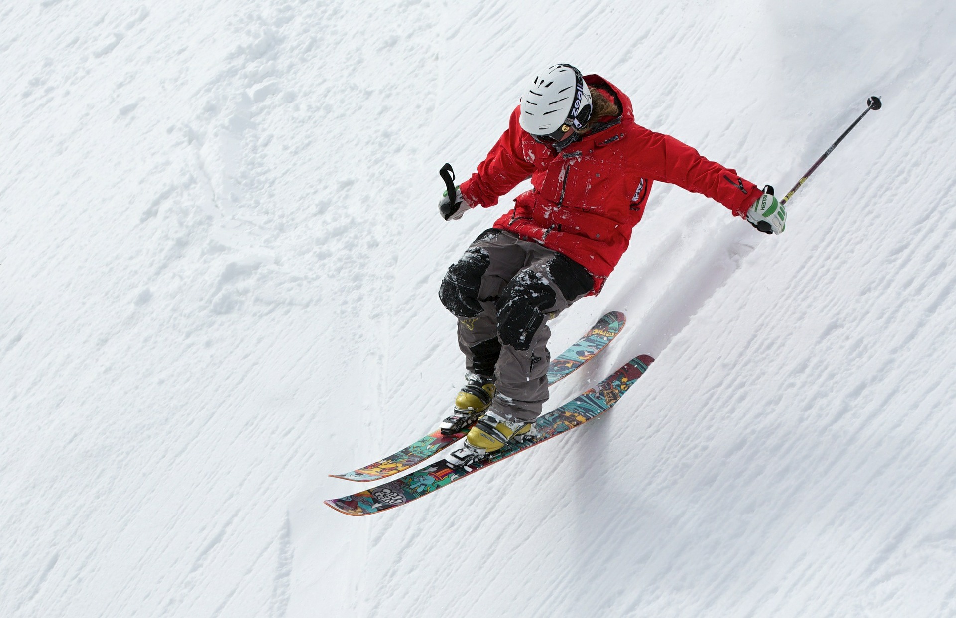 Skier red jacket steep slope 1920 × 1242