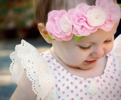 Young girl with flowers in her hair (Tourette Syndrome)