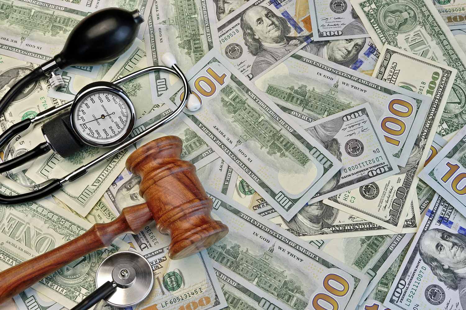 Judges Gavel And Medical Tools On Dollar Cash Background