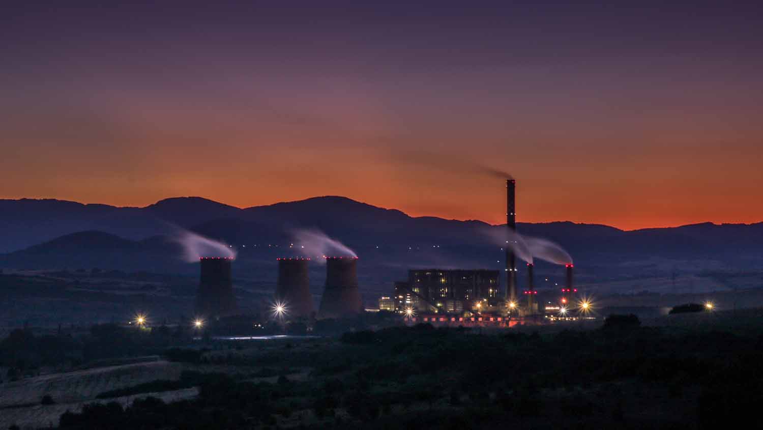 polluting factory at dusk 1500 x 845
