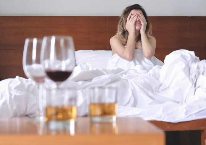 Is it a Bad Hangover or Something More Serious woman with bad hangover
